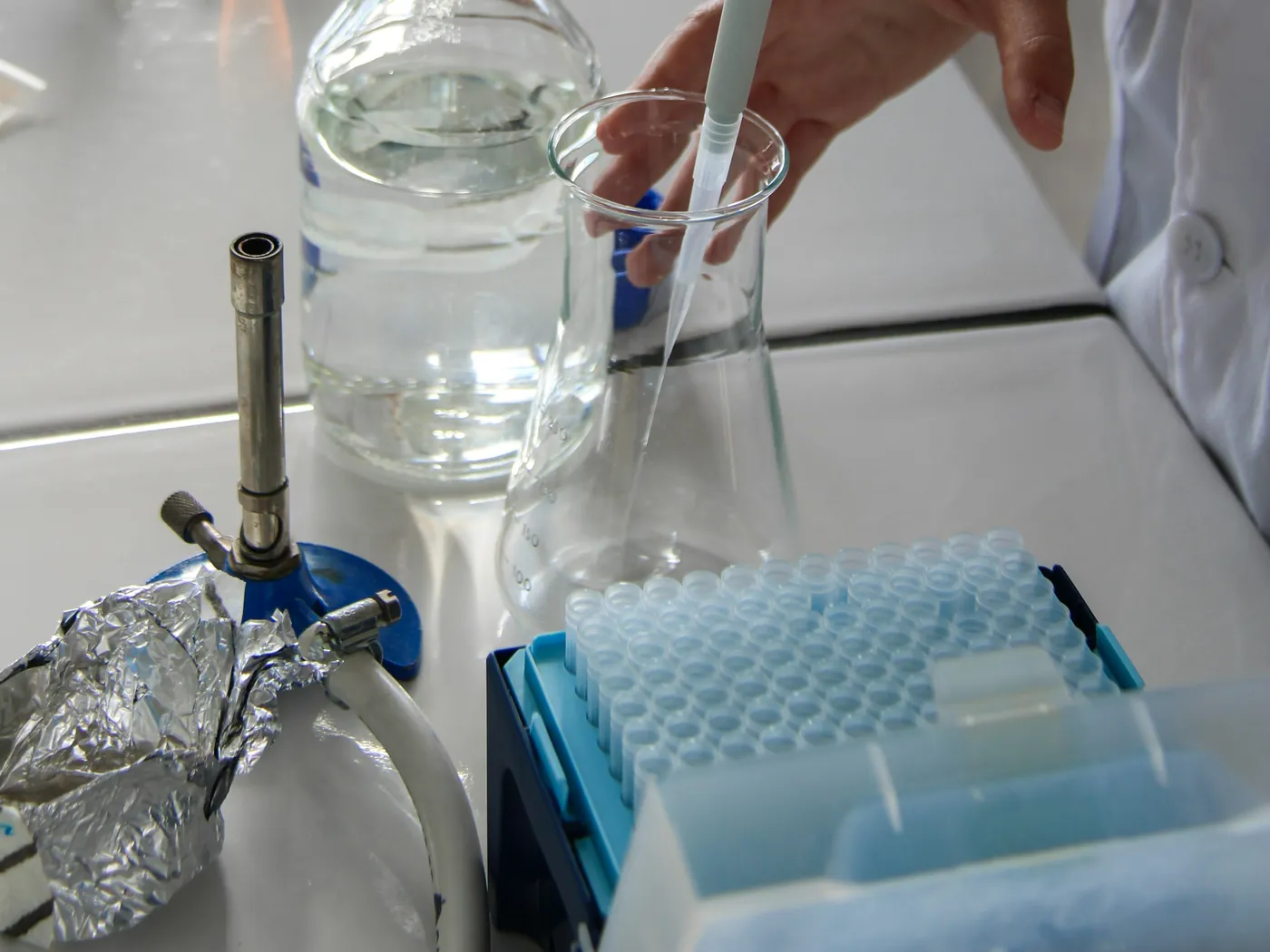 Pipette and a box of blue pipette tips